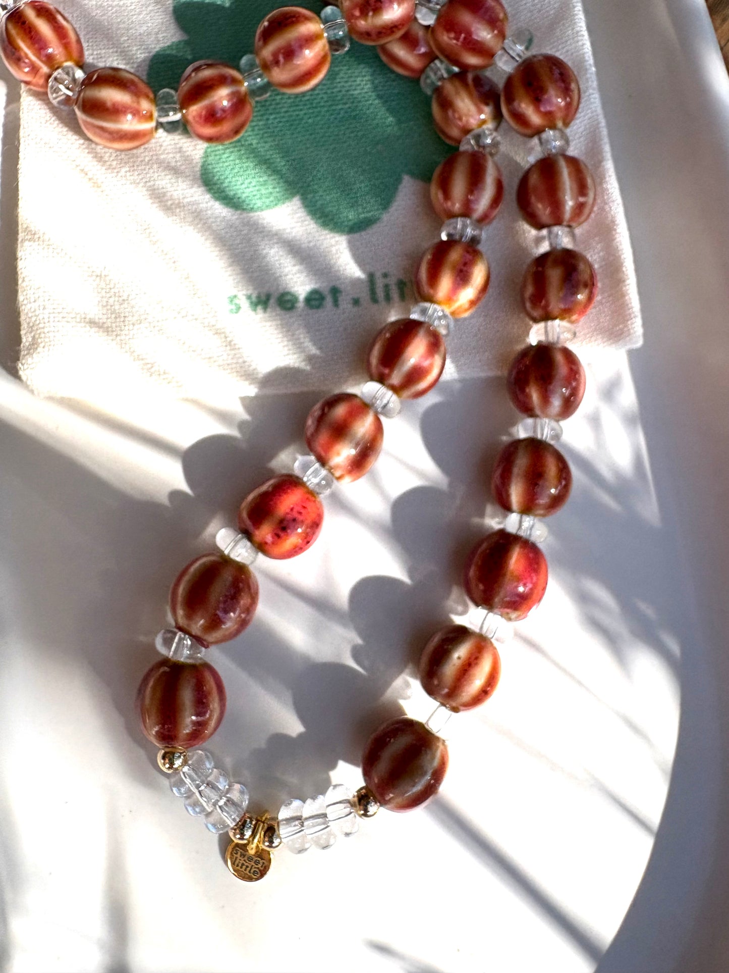 Striped ceramic and glass beaded necklaces