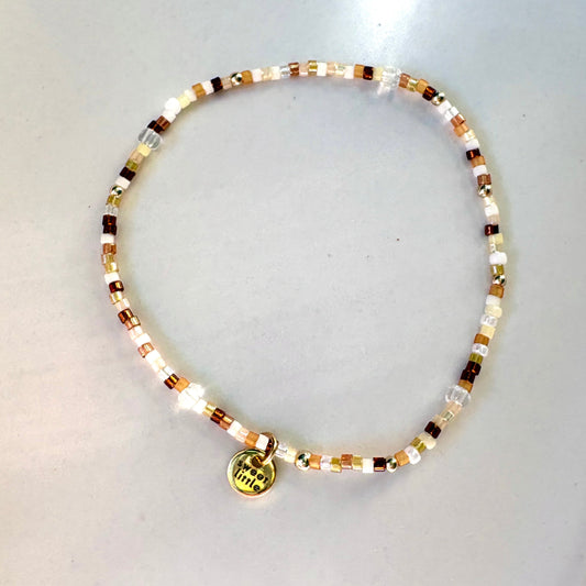 Browns and golds striped bracelet