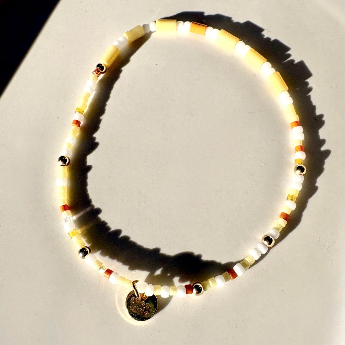 Yellows and browns striped bracelet