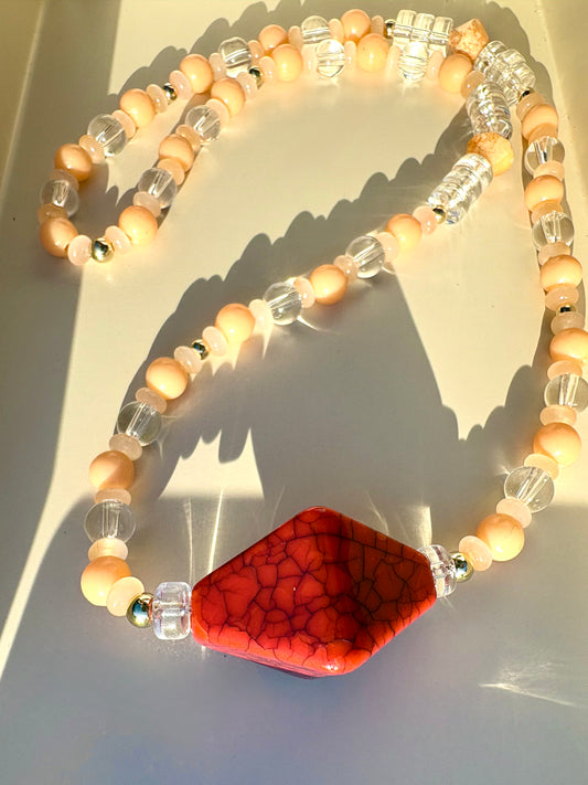 Peachy, glass beaded necklace with red geometric centerpiece