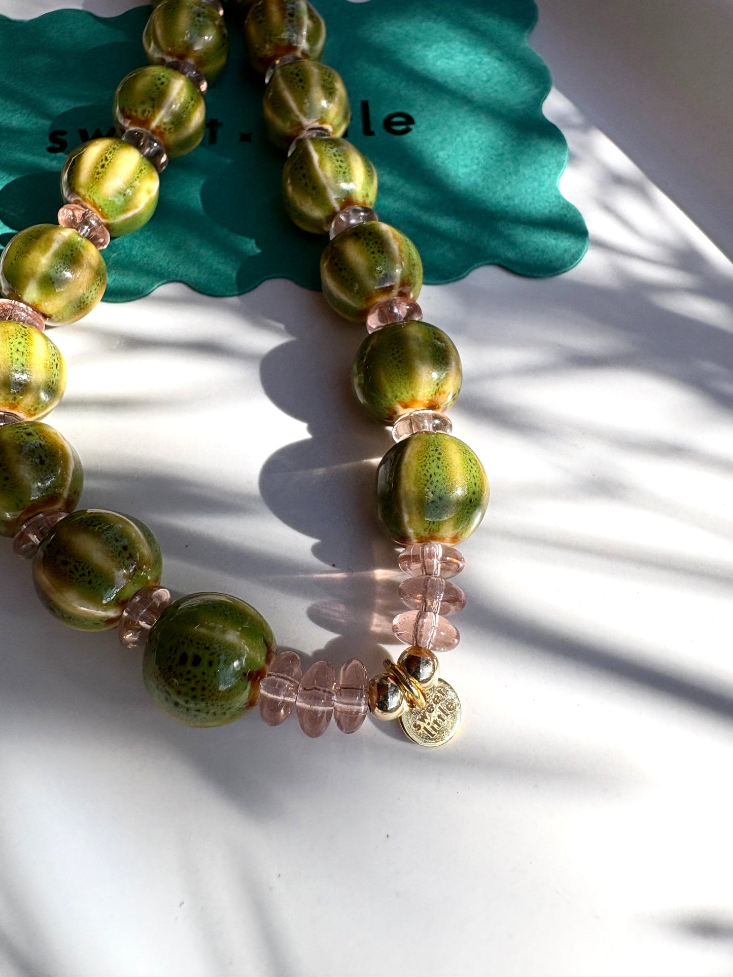 Striped ceramic and glass beaded necklaces