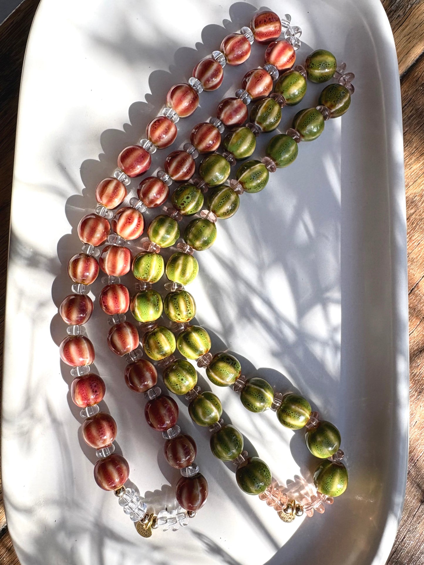 Striped ceramic and glass beaded necklaces