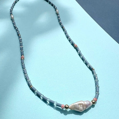 Fine blue tube bead necklace with stick pearl