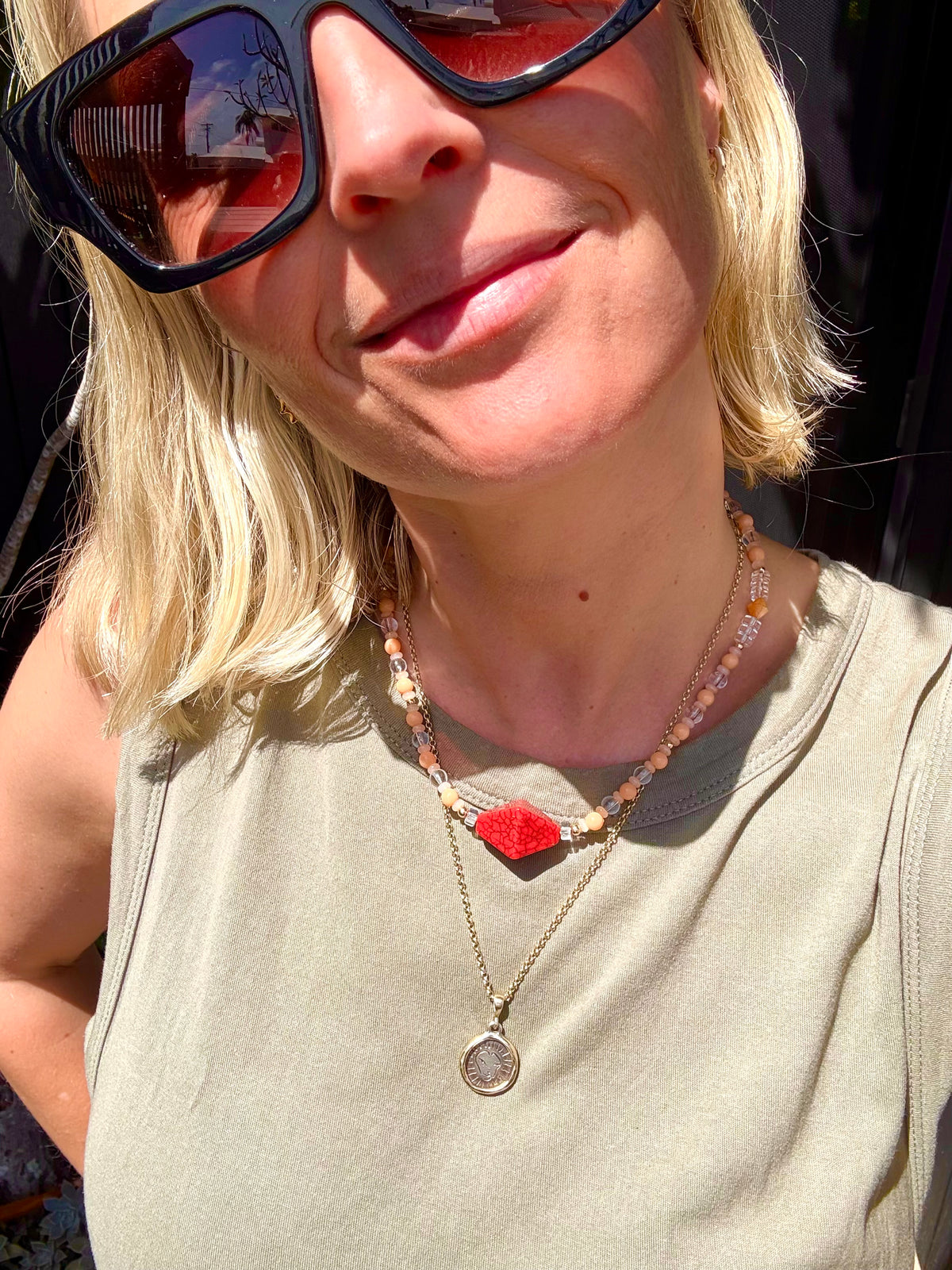 Peachy, glass beaded necklace with red geometric centerpiece