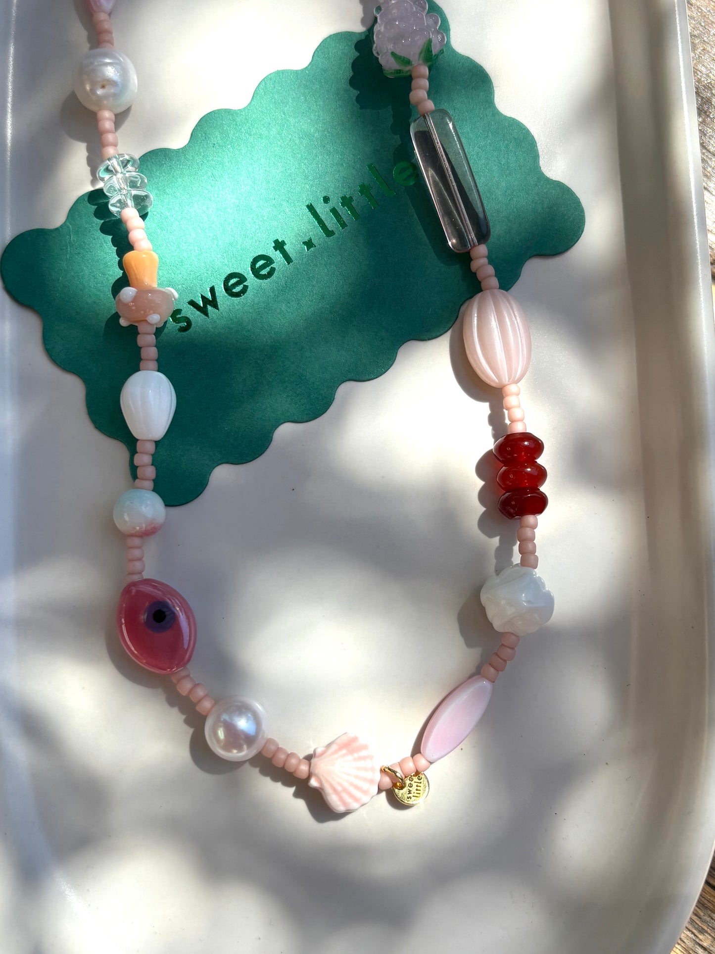 Charm necklace in pinks