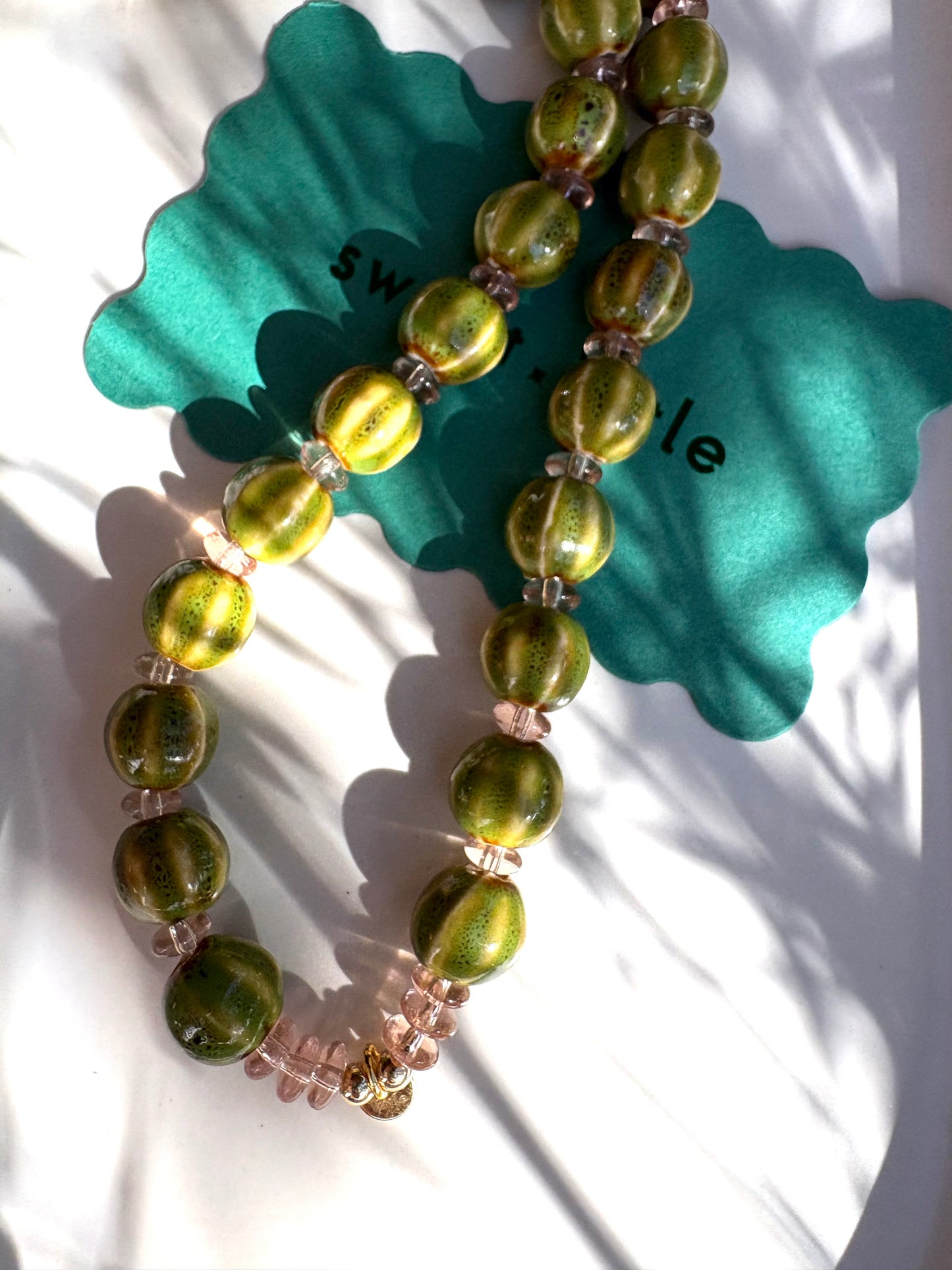 Striped ceramic and glass beaded necklaces