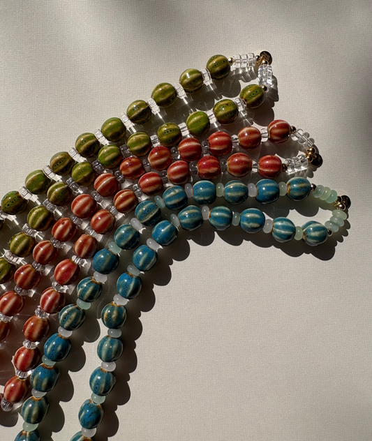 Striped ceramic and glass beaded necklaces