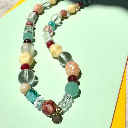 Browns, greens and cream mixed bead necklace